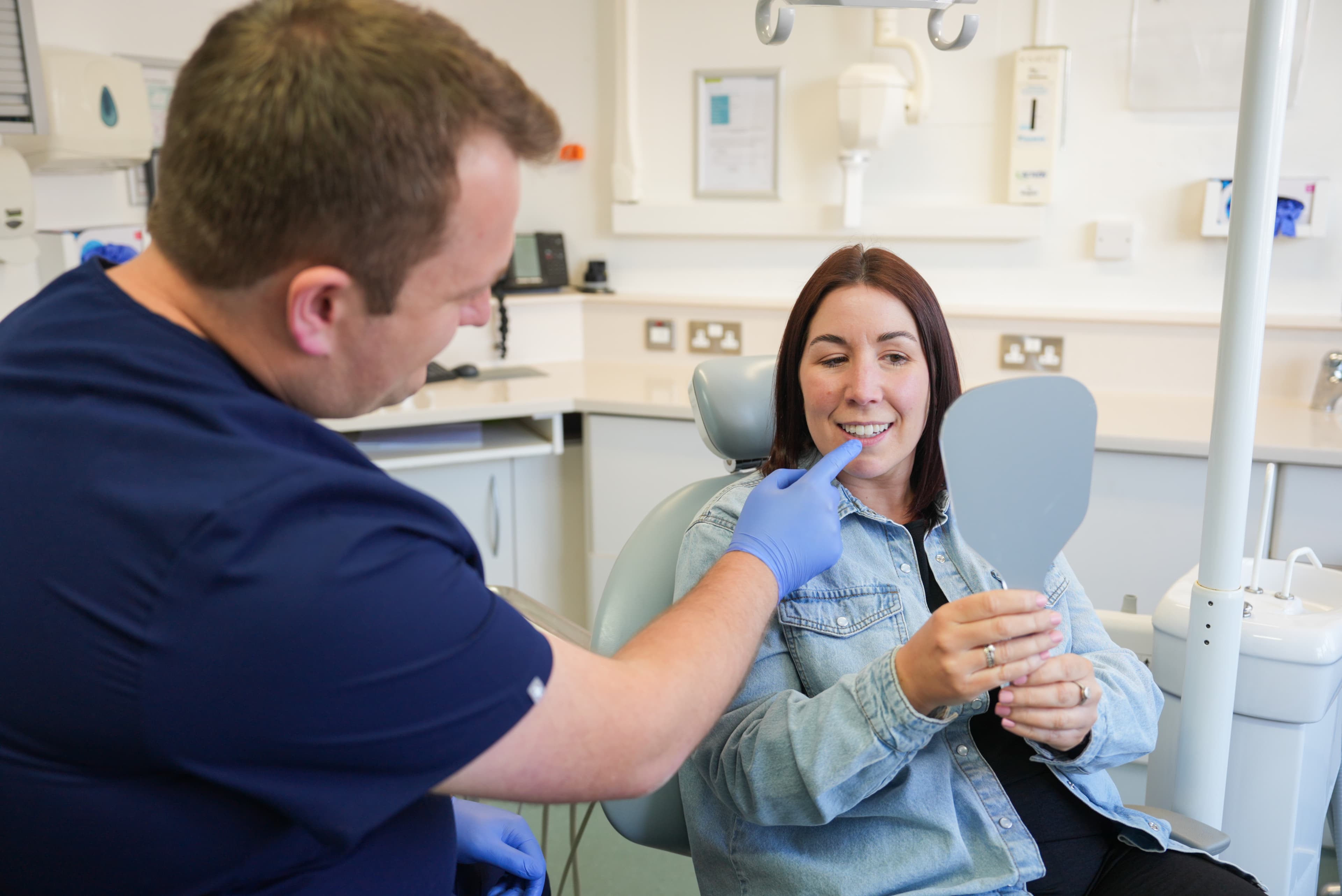 Dr Sean Roberts discussing a patient's smile during a cosmetic dental consultation