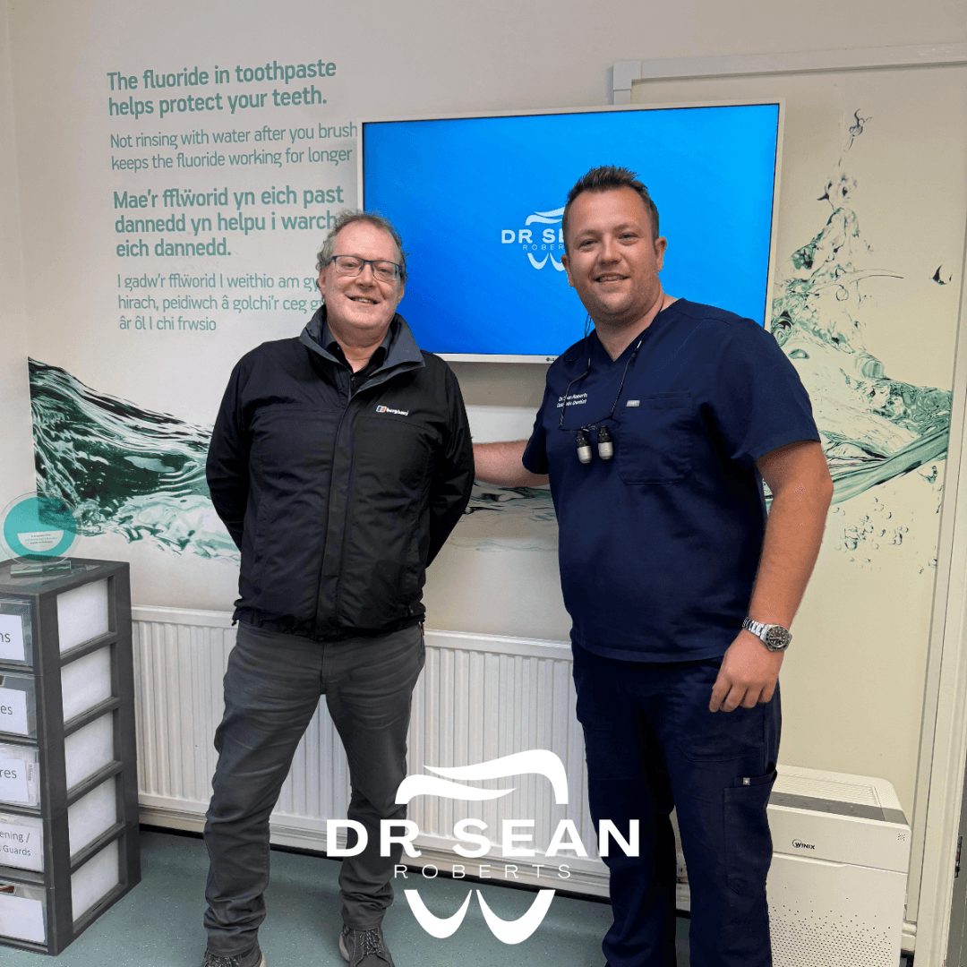 Dr Sean Roberts with a patient at his Aberystwyth dental practice