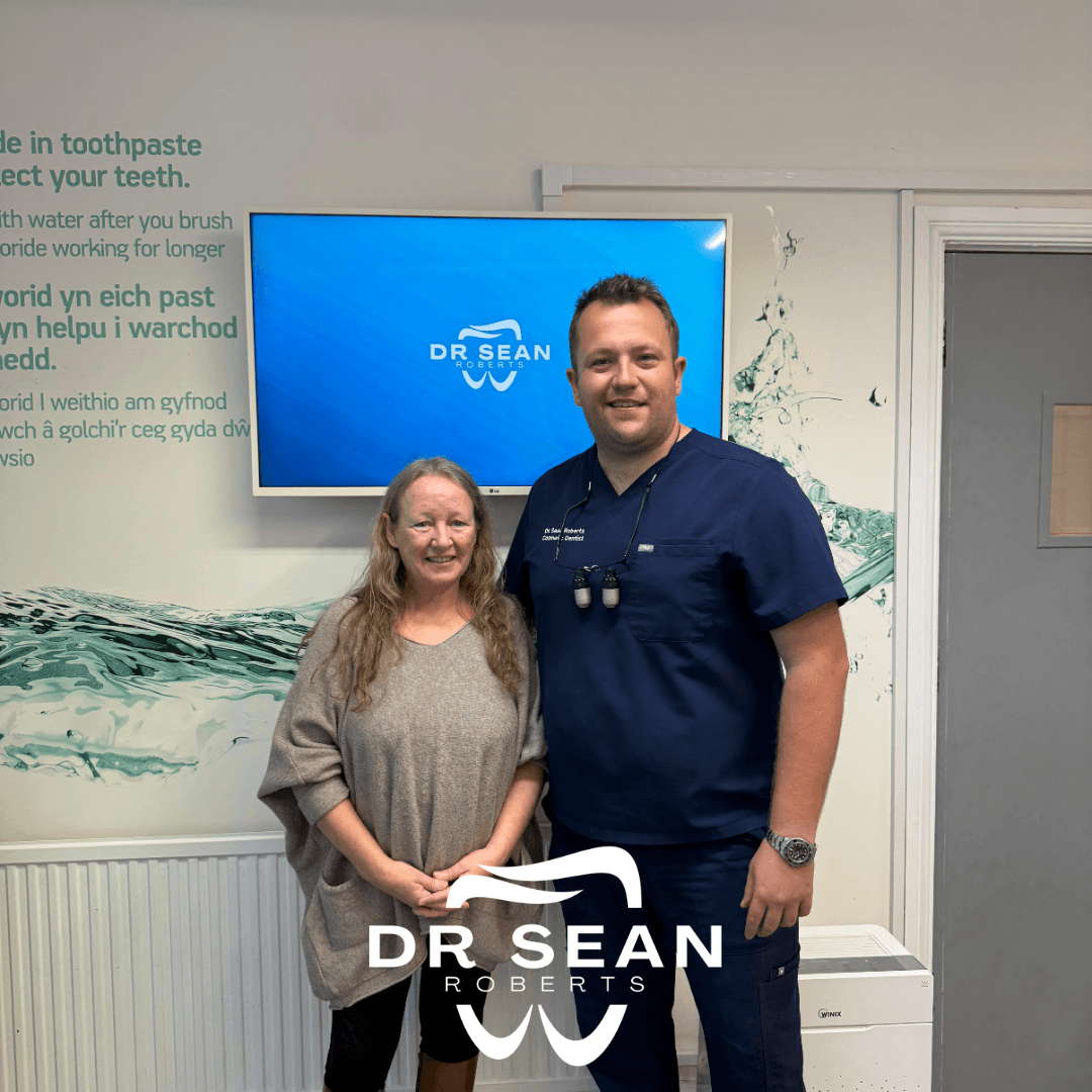 Dr Sean Roberts with a patient following a dental appointment in Aberystwyth