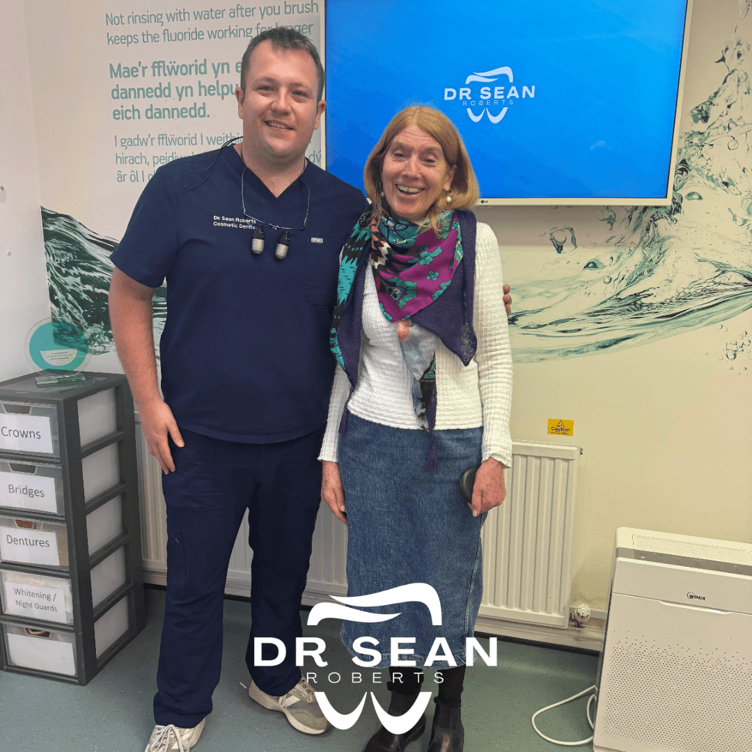 Dr Sean Roberts with a smiling patient at Friars Dental Clinic in Aberystwyth