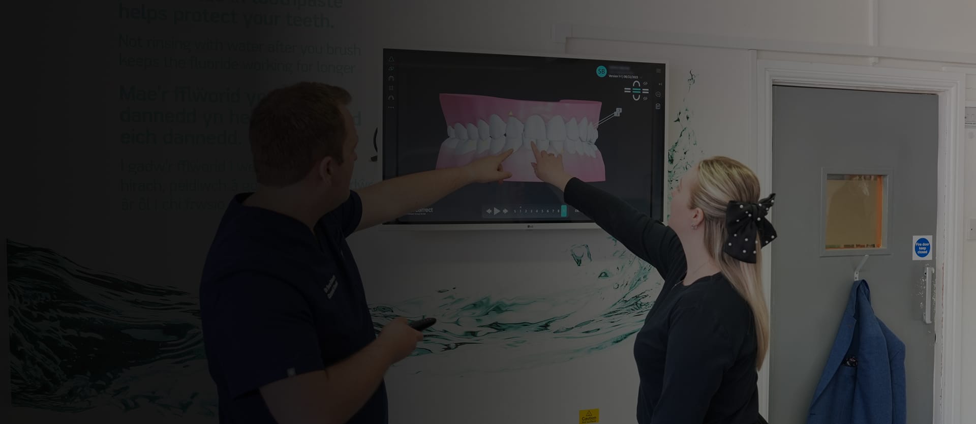 Dr Sean Roberts reviewing a 3D digital dental scan with a patient in Aberystwyth